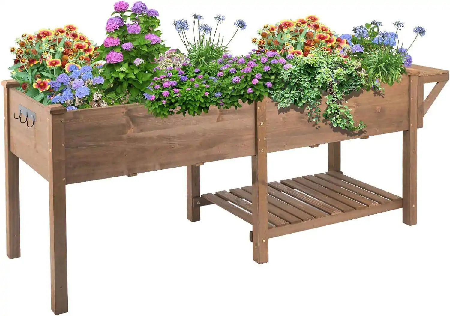 Garden bed with tools and gardening gloves nearby