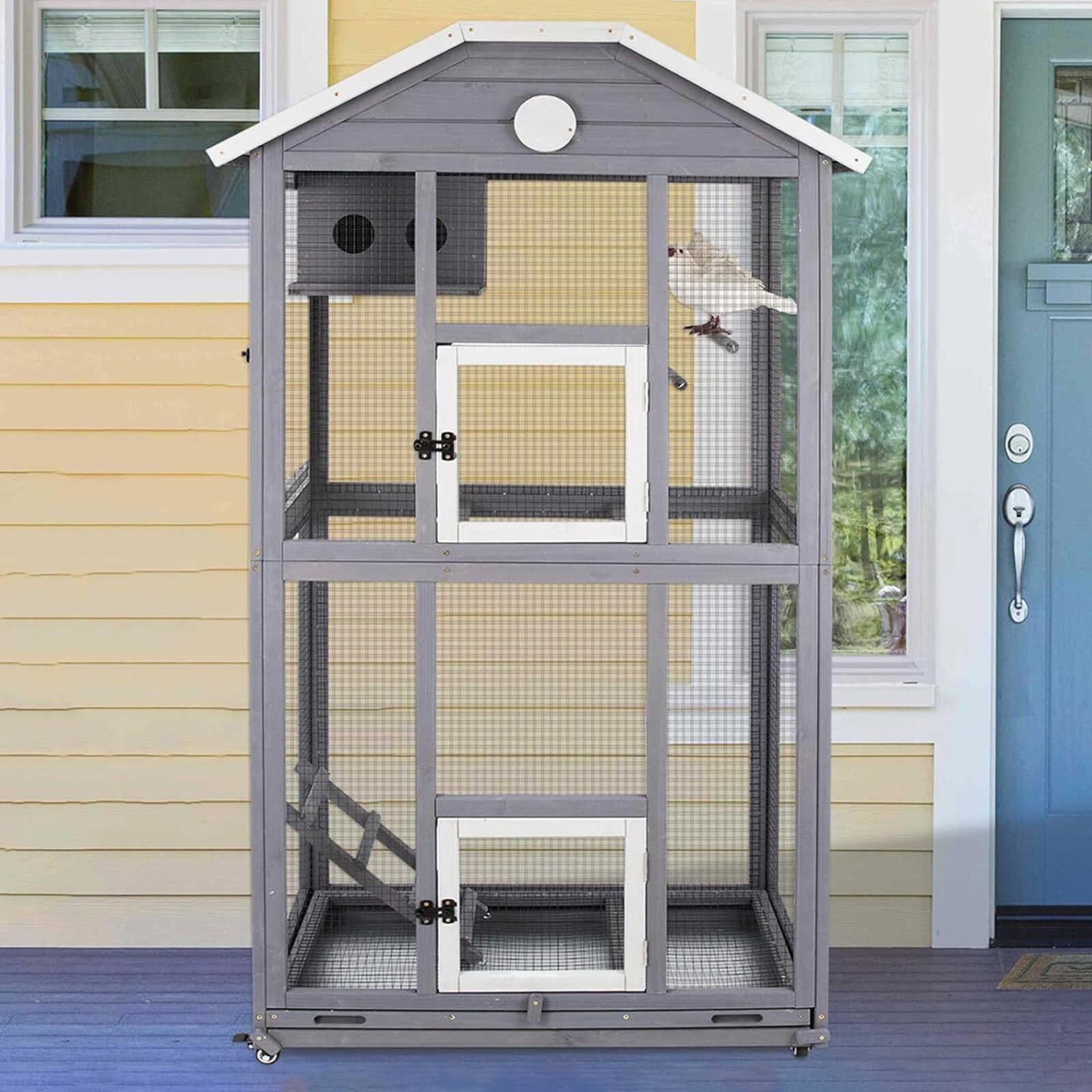 Large bird cage with multiple perches and wooden frame