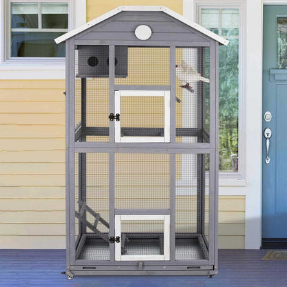Large bird cage with multiple perches and wooden frame